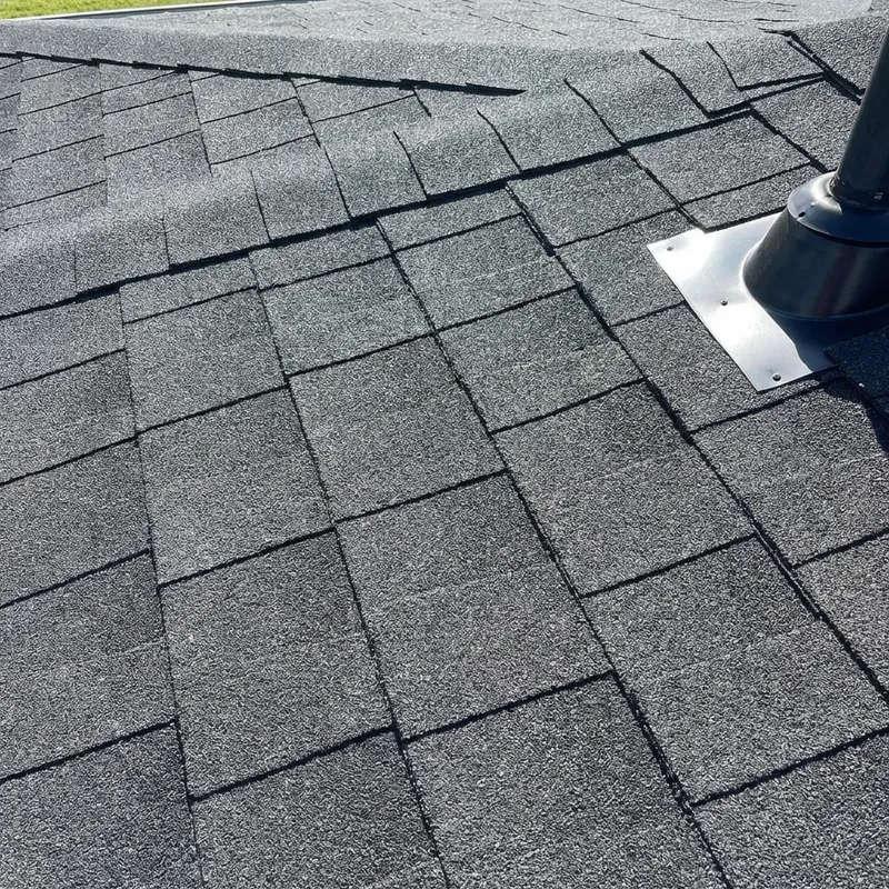 Newly repaired roof shingles in perfect condition